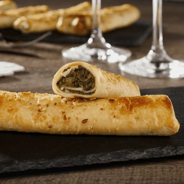 Flautas de rulo de cabra y espinacas