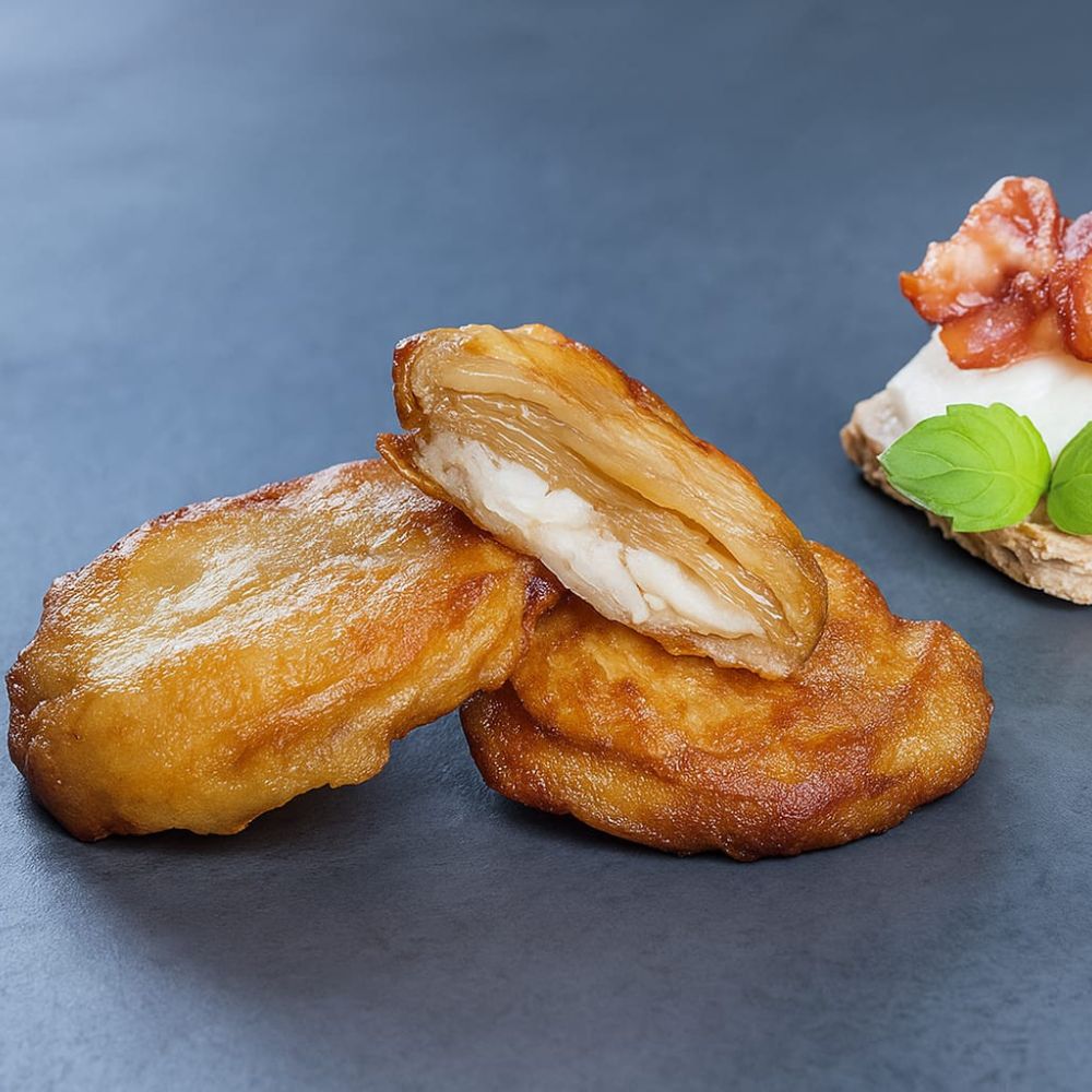 Patata de olot de rulo de cabra y cebolla caramelizada