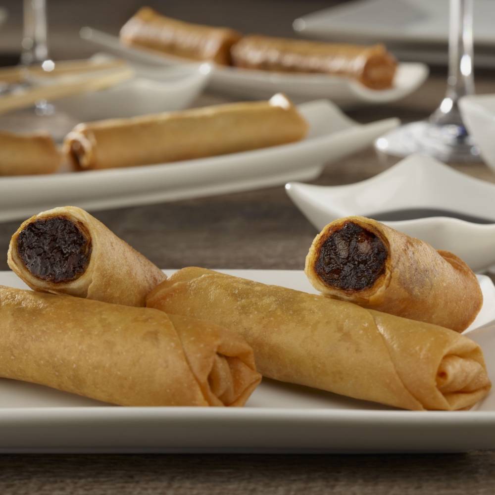 Rollitos de morcilla con manzana caramelizada de canela en rama